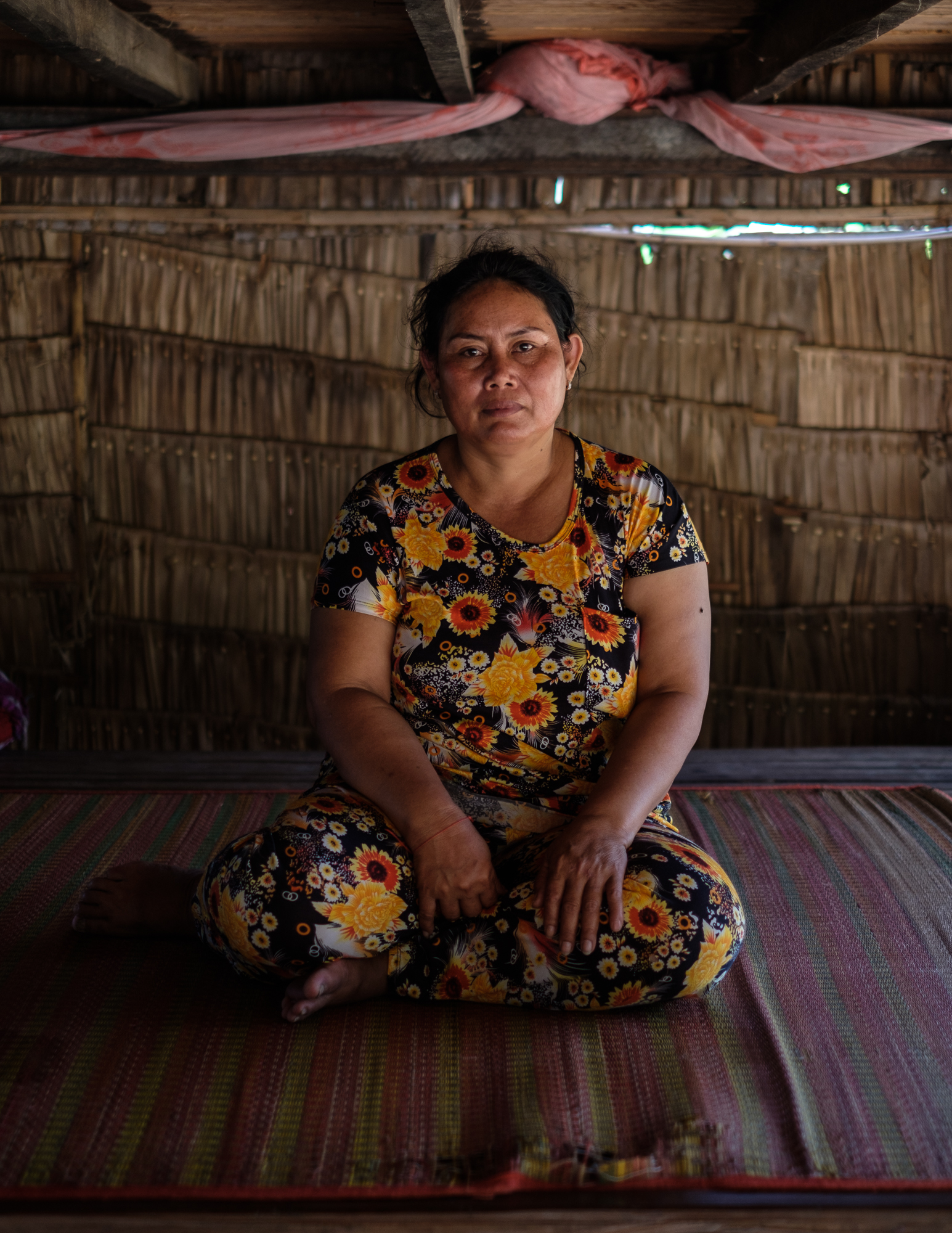 A portrait of Chreng Saren. The 45 year old garment factory worker injured her fingers and bruised her ribs when the truck she was riding on to work overturned.