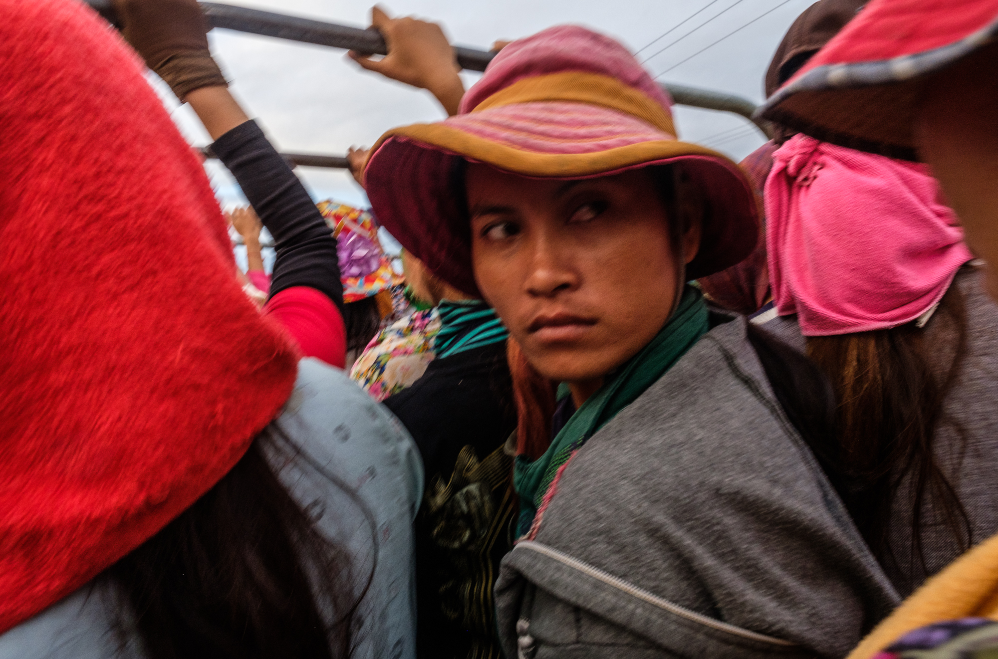 The conditions on the trucks are often cramped, with as many as 50 people fitting into one flatbed.