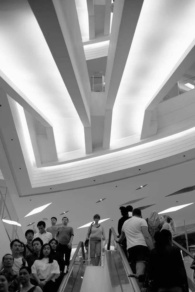 Lady waiting at the top of the escalators, Bangkok, July 27, 2015.