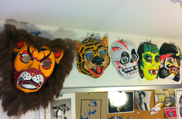 Vintage and reproduction retro masks above my studio table. I love the colors!