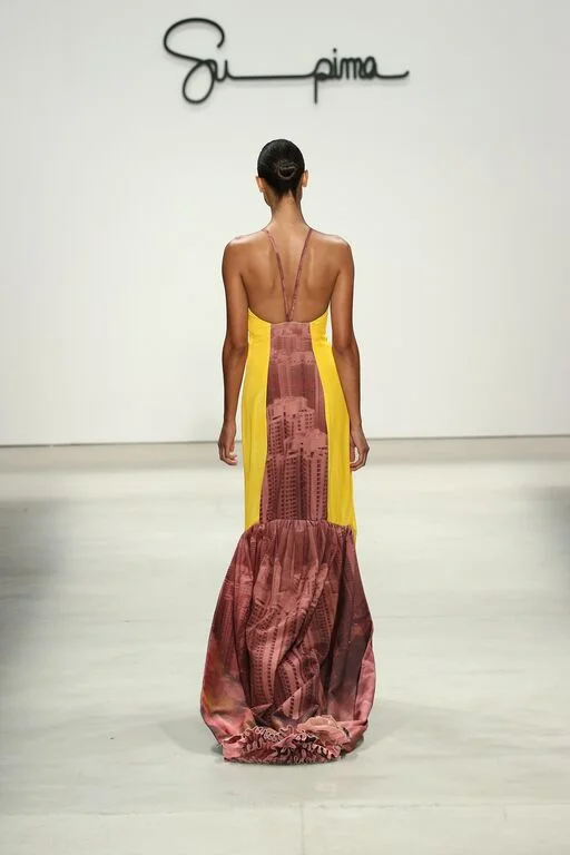 Denim cape look down runway .jpeg