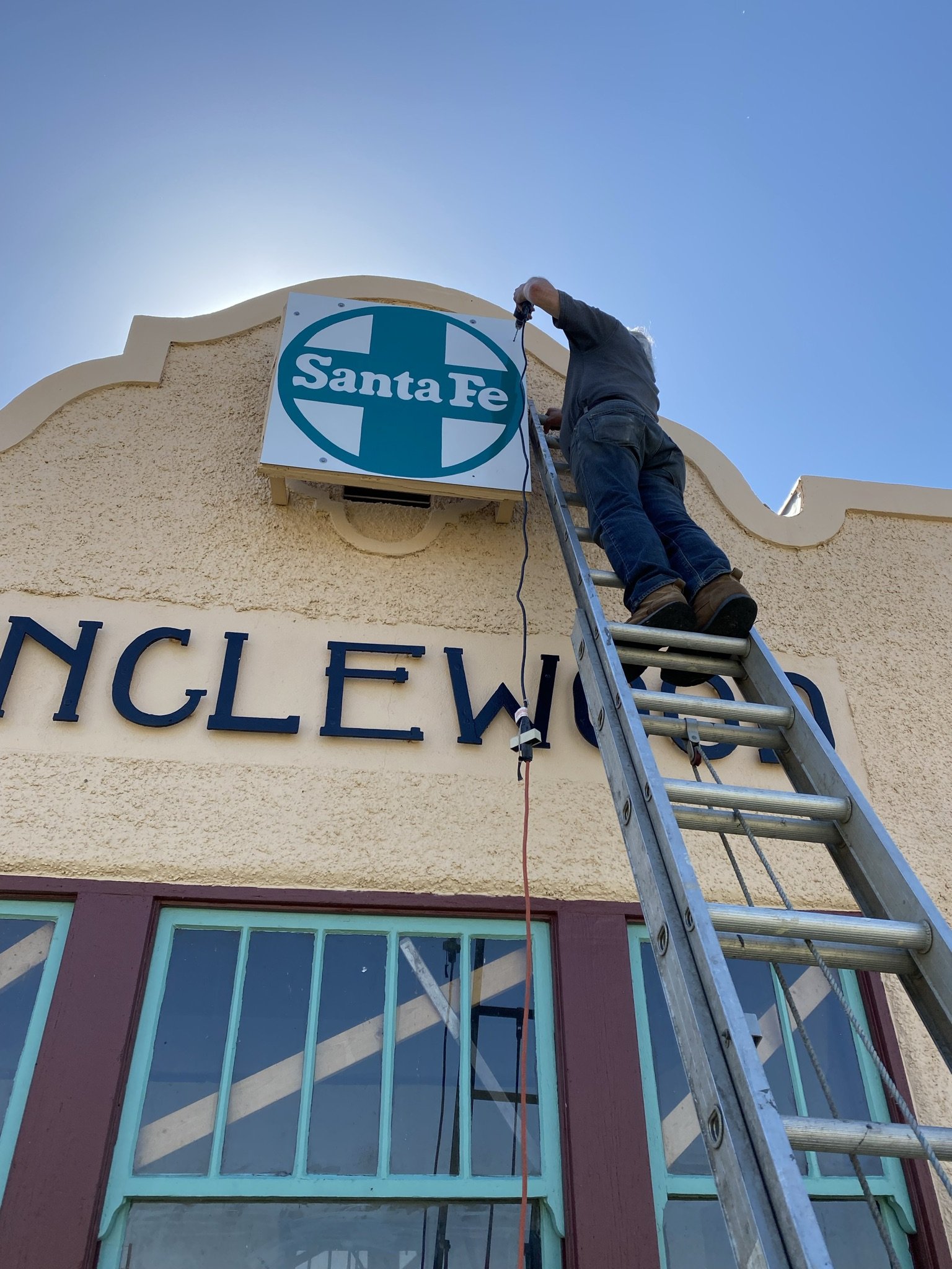 Bryan putting up sign.jpeg