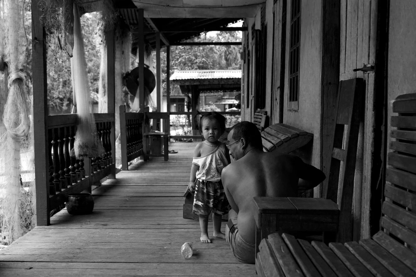  Borneo, Indonesia, Dayak tribe in long house. 