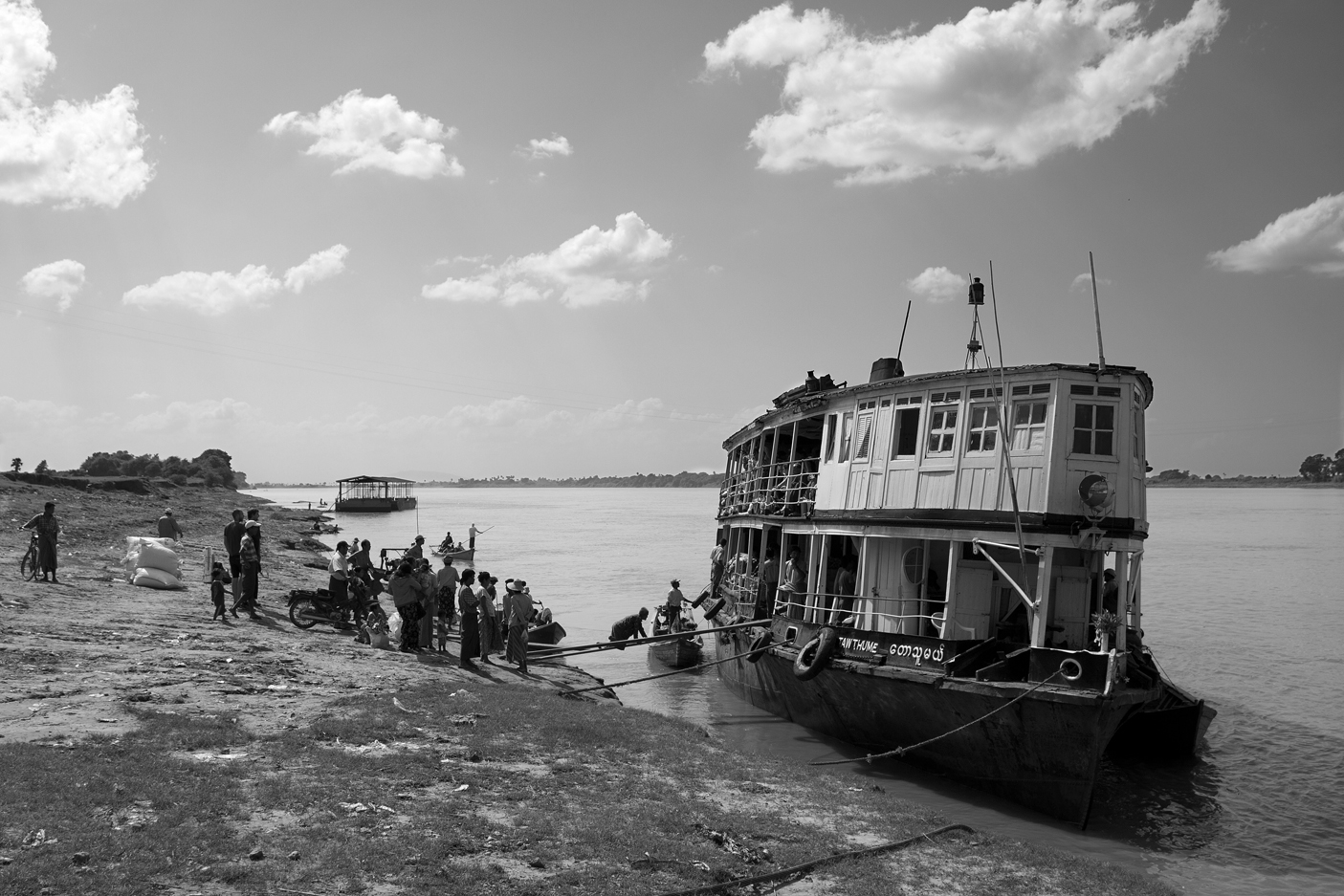  Burma, boat on the Ayeyarwaddy river stopping at every villages to provide food. 