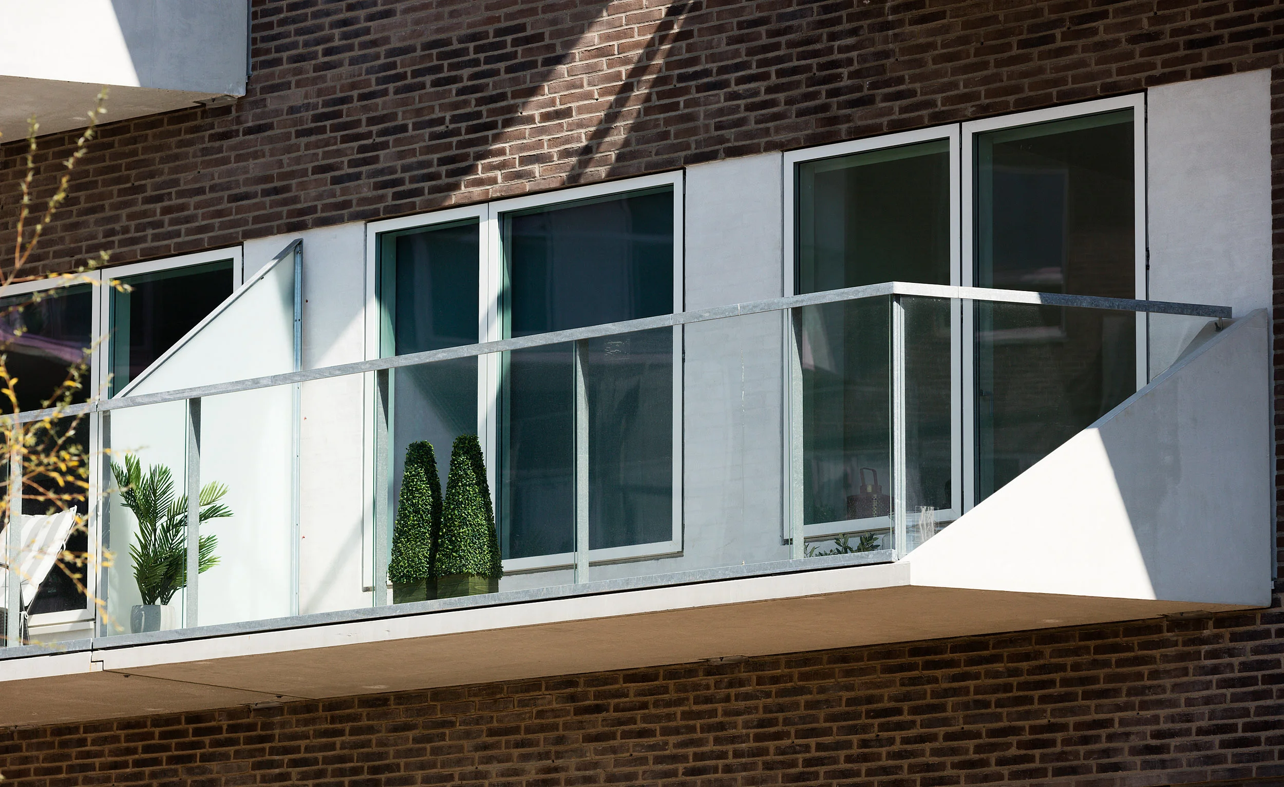 Residential housing, Skibbroen, realised by Holscher Nordberg Architects. Photographed from early morning throughout the day, letting the sun emphasise the various aspects of the buildings character. The special life that characterizes Skibbroen occurs due to users’ various activities and the mix of tranquility, activity, transit and practical doings.The uniqueness of the channel and harbor space is maintained. Photographed from early morning throughout the day, letting the sun emphasise the various aspects of the buildings character. 
