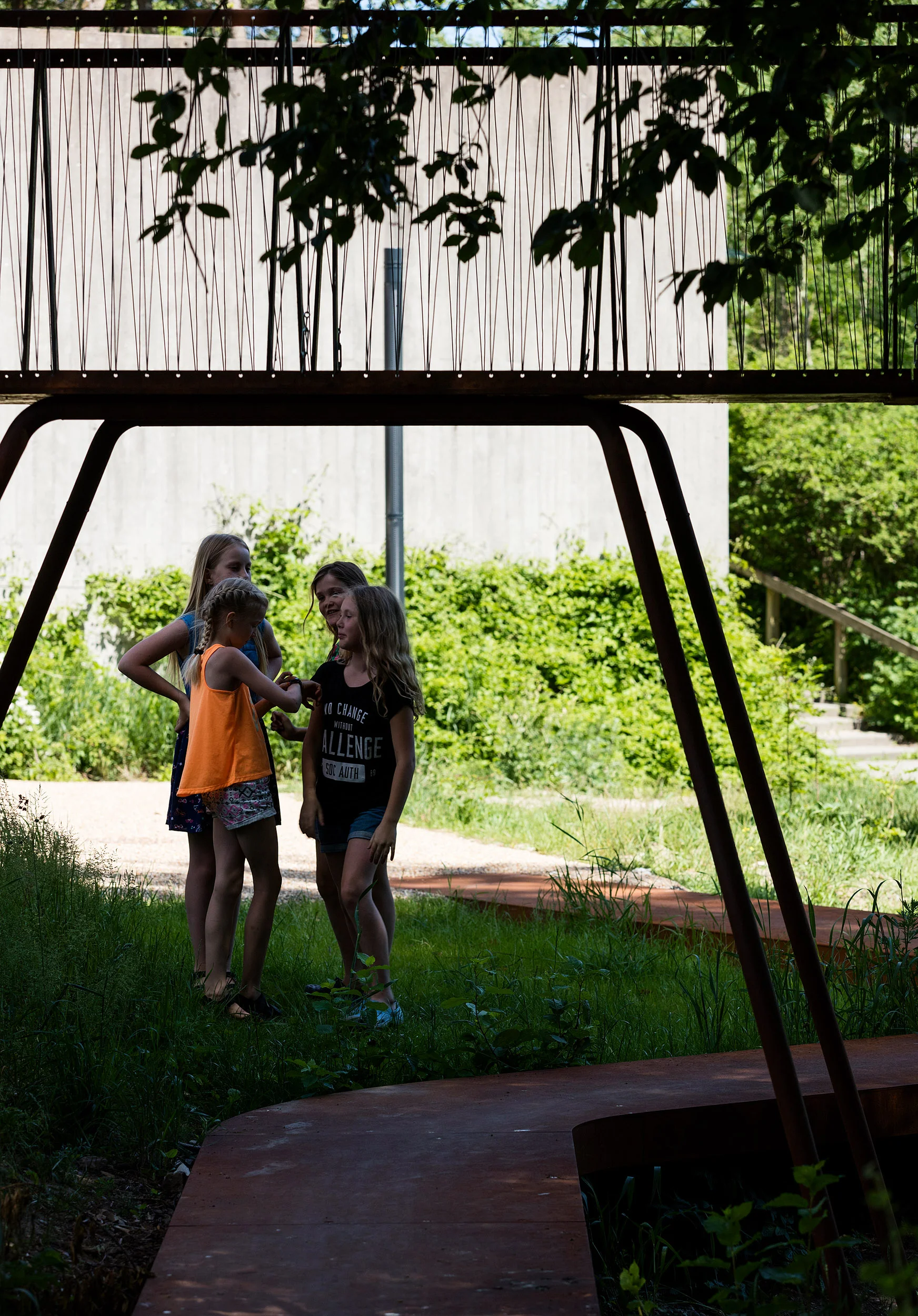 The Loop, realised by Holscher Nordberg Architects Værebro Park, a residential area in the suburbs of Copenhagen, has in the last years suffered from high crime rates and a declining number of inhabitants. Placed in the intersection between an indoor swimming pool, a primary and secondary school, and the 1400 dwellings of Værebro Park, the activity path aims to create a physical and mental bridge between the different users of the area. The low budget yet esthetical element is designed as a playful path offering a variation of activities.