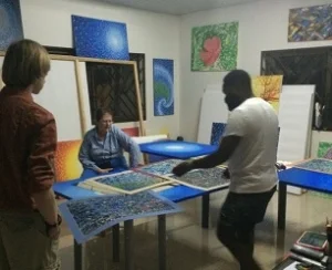 Yonkofa Project volunteers visiting Ghanaian artist&nbsp;"Fishman" Kobina Nyarko, who is internationally renown for his mesmerizing&nbsp;paintings, and&nbsp;was recently featured on CNN as one of Ghana's most prominent artists. His work will be avai…