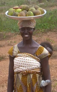 This beautiful mother brings oranges for the workers at our construction site, and we are always happy to see her!