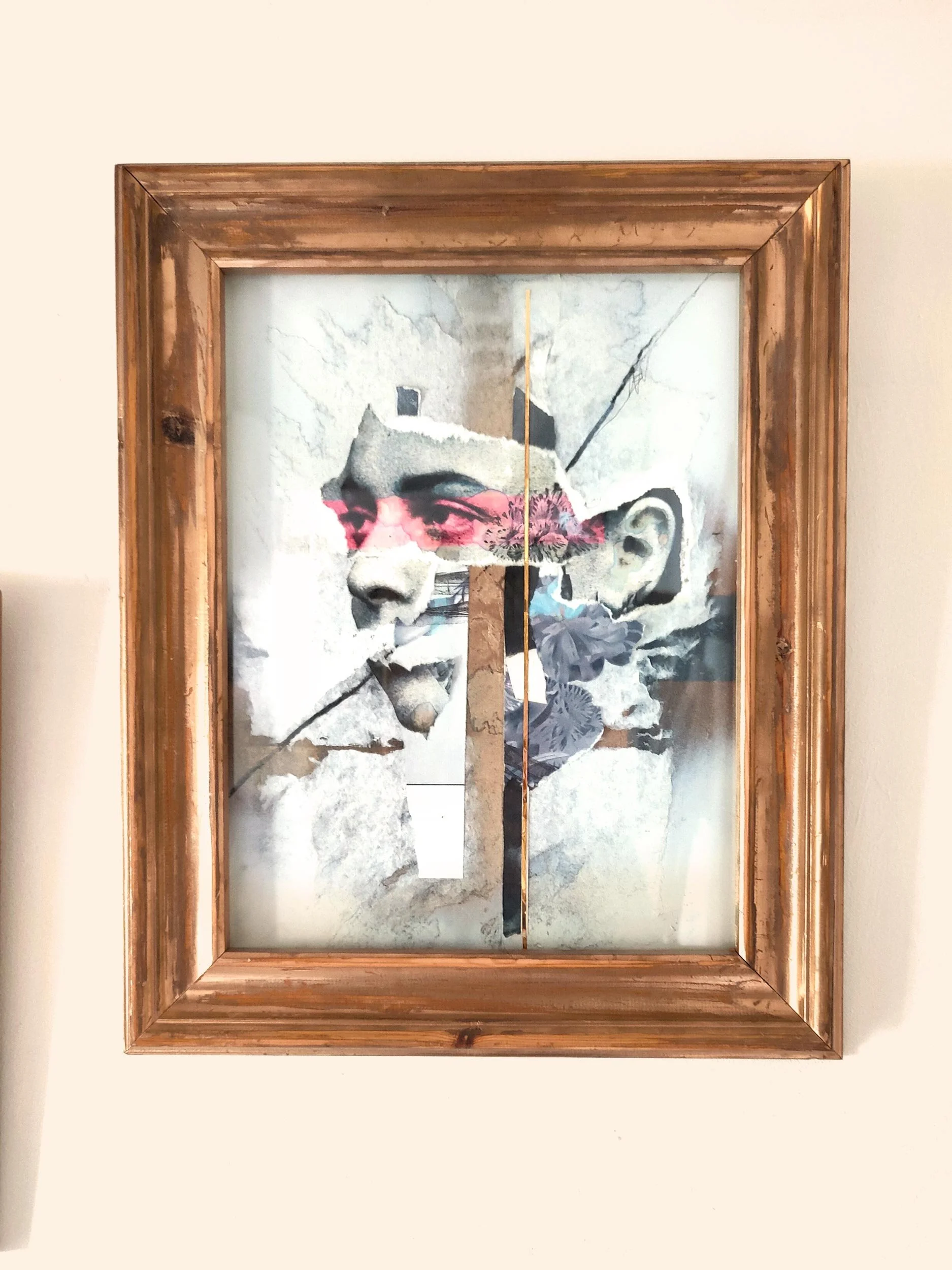 the-gaze-collage-artwork-in-frame-closeup-on-wall.jpg