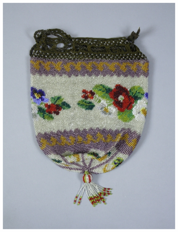  A beaded purse with a floral pattern. There is a brown crocheted edging along the top of the back to attach a drawstring. The drawstring is a brown cord. The beads appear to be attached by a netting technique. There is a beaded tassel at the bottom 