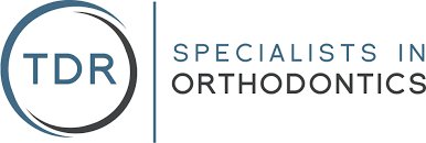 The TDR Specialists in Orthodontics logo.