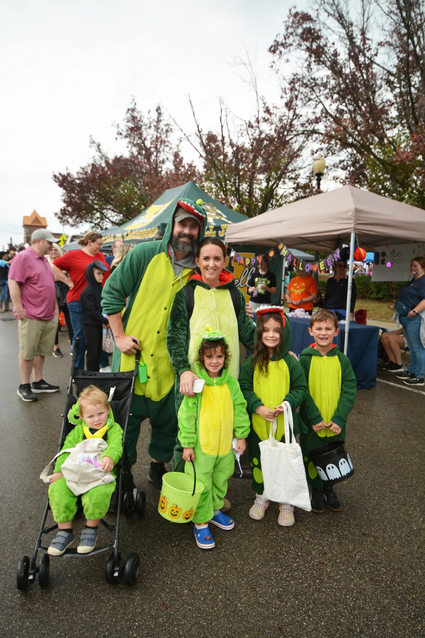 A family of six is dressed as dinosaurs and are ready for trick or treating.