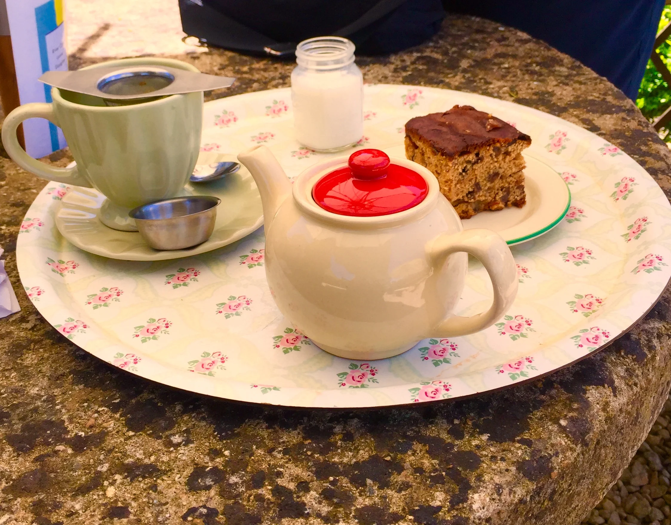 On the right above the teaot is tea cake which contains tea soaked raisins.