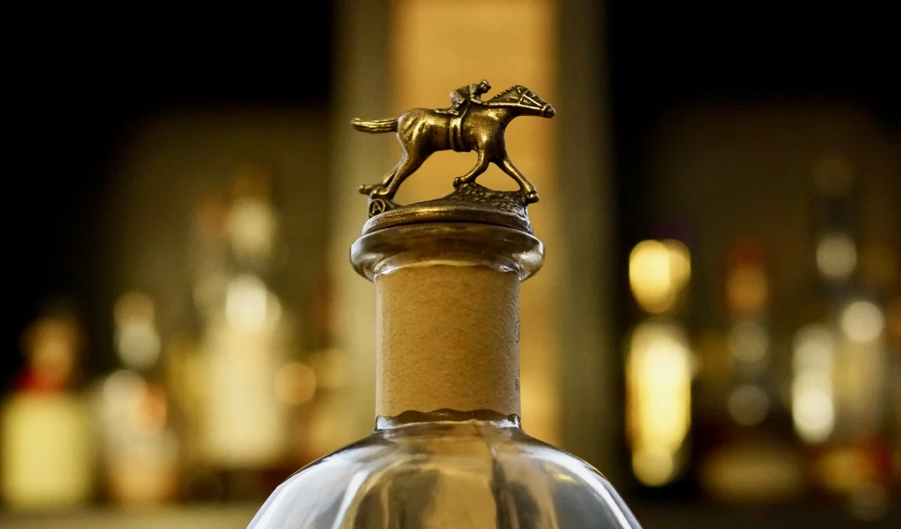There are 8 collectable cork tops that spell-out Blanton's