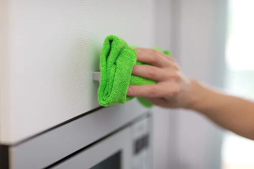 Pro tip: Color code your cloths to avoid cross-contamination. We like to follow a traffic light system: red for the bathroom, yellow for the kitchen, and green everywhere else.