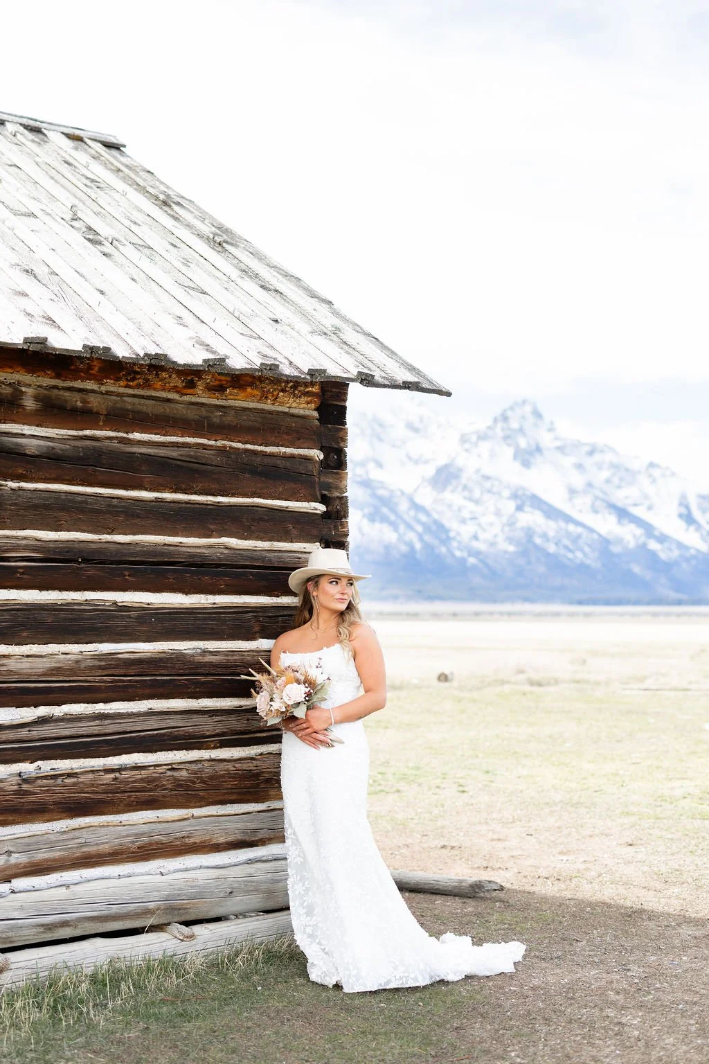 Bustle bride wearing Anne Barge wedding dress and cowboy hat