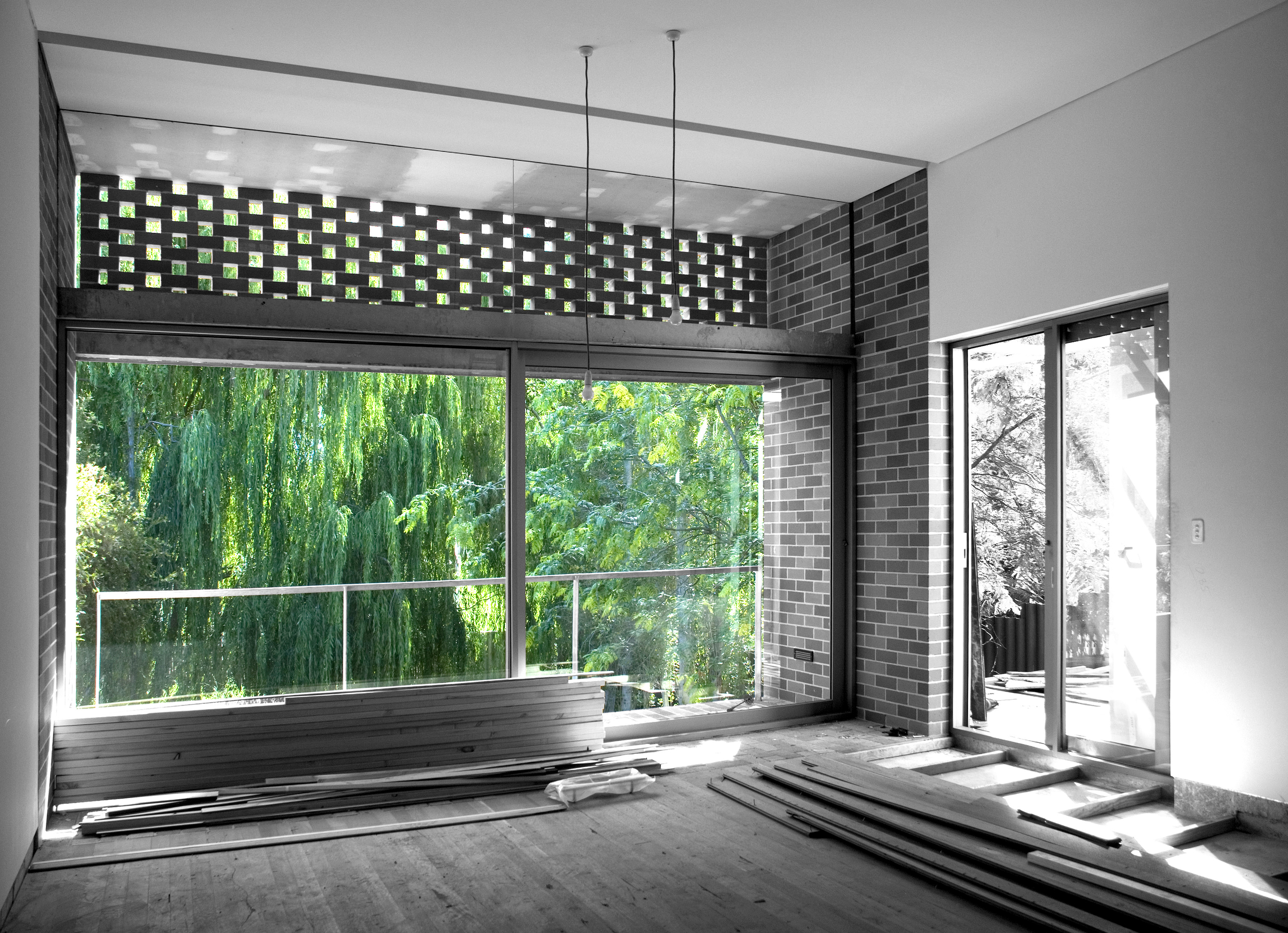 living room with brick threshold