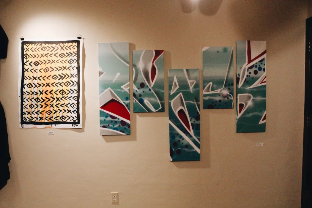 Pictured on the left: painting on paper by Eric Vozzola, Pictured on the right: multi-canvas painting by Black57 Photo: Victoria Fong