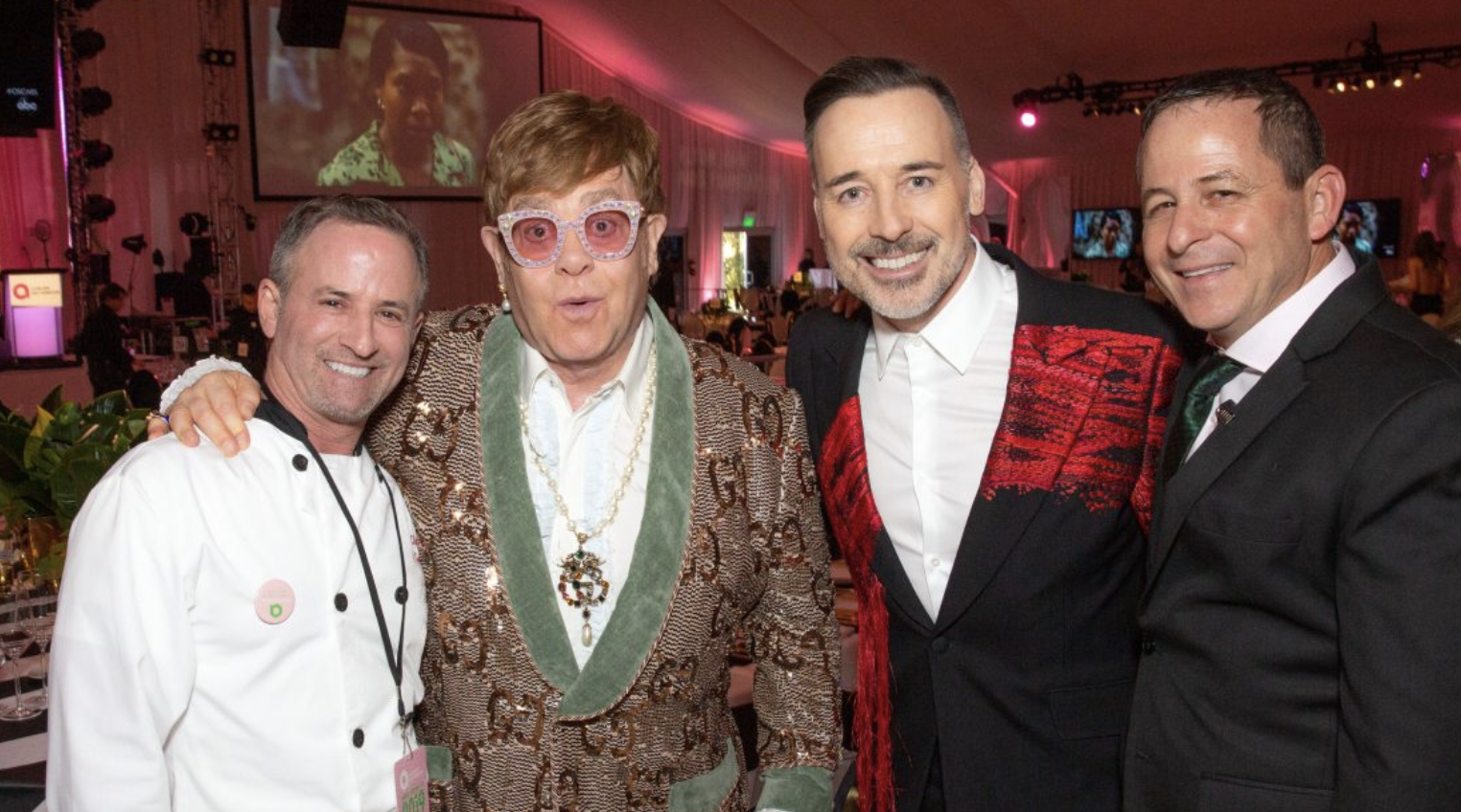 Chef Wayne Elias (left) and his business partner Chris Diamond (right) join Sir Elton John and husband David Furnish Photo Courtesy of Brian To/ Crumble Catering