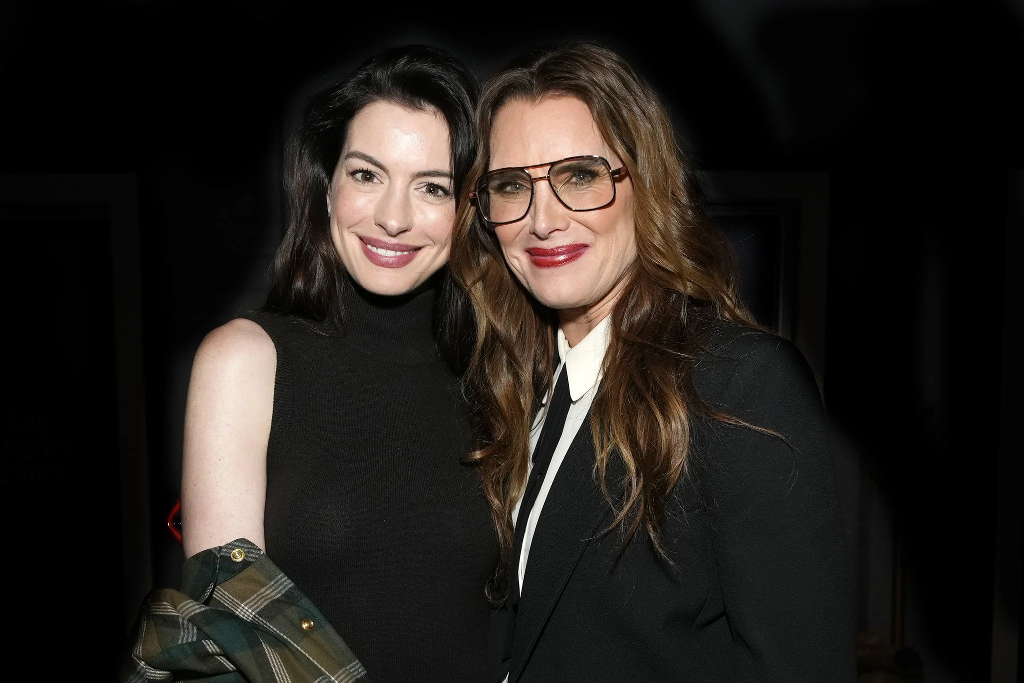 Actress Anne Hathaway, left, of “Eileen” poses with Brooke Shields of “Pretty Baby” at the Los Angeles Times Studio presented by Chase Sapphire during the 2023 Sundance Film Festival, Saturday, Jan. 21, 2023, in Park City, Utah.