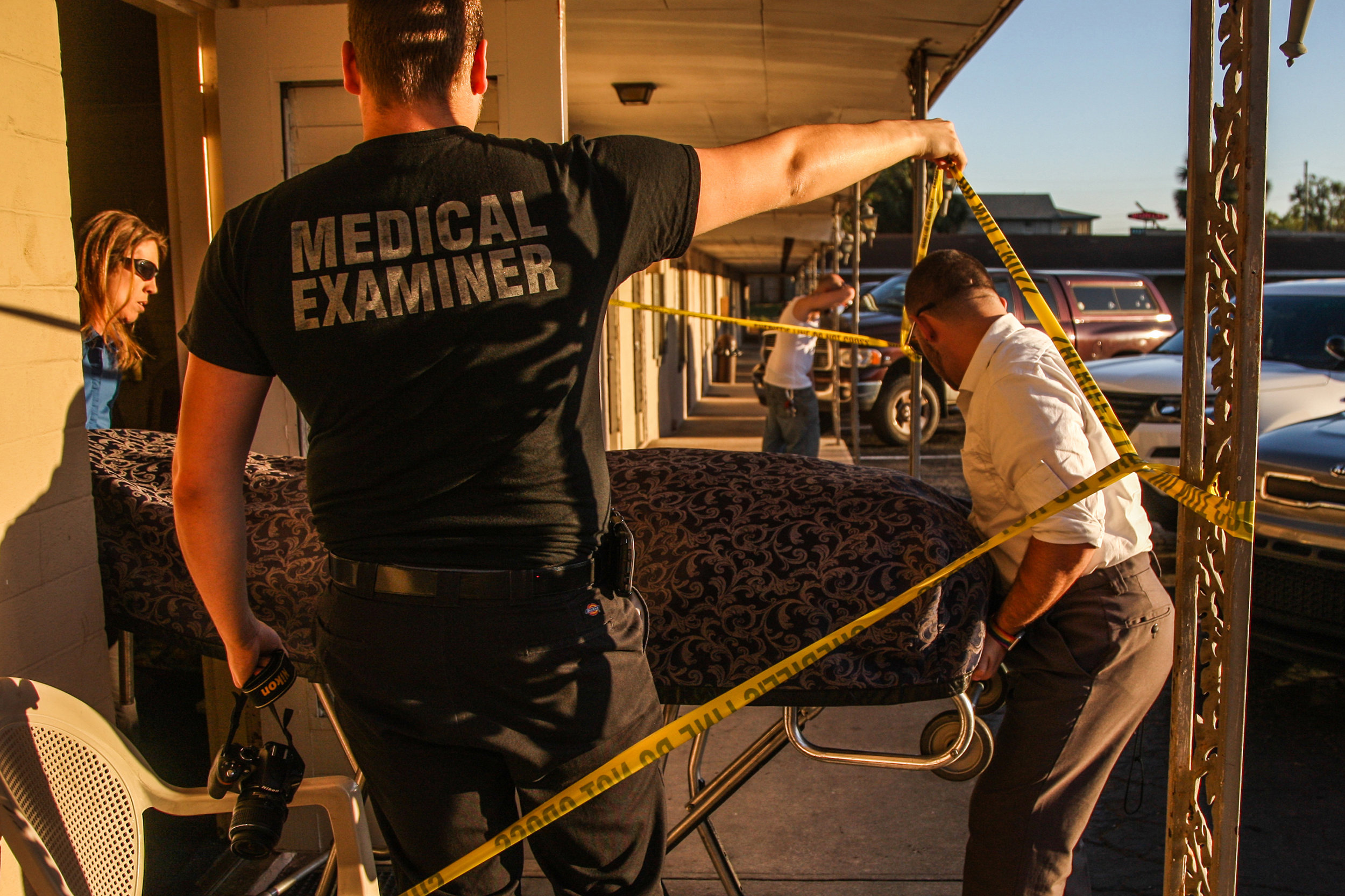  Medical examiners remove Paul Gagne Jr.’s body from a Boulevard Motel room. Based on drug paraphernalia at the scene, Volusia County Sheriff’s Office investigators believe Gagne overdosed on drugs. Charles Chancery, shown standing in the background,
