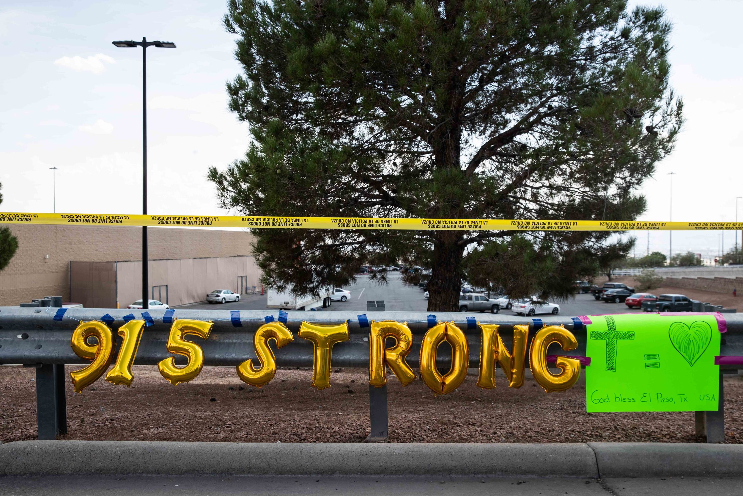  El Paso area code 915 and the word "strong" spelled with golden balloons are placed on the scene where a mass shooting occurred in Walmart last Saturday morning to honor their memory in El Paso on Monday, August 5, 2019. 