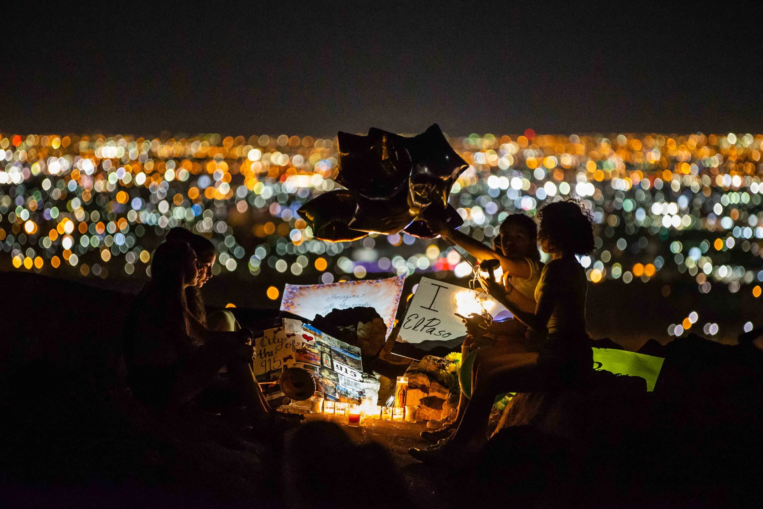 A group of students from Loretto Academy, Britney, Andrea, Alexa, Chloe, Amanda and Monique, set a makeshift memorial for the El Paso victims by candlelight at the Scenic Drive - Overlook to honor the victims of the mass shooting occurred in Walmart last Saturday monirng in El Paso on Monday, August 5, 2019.