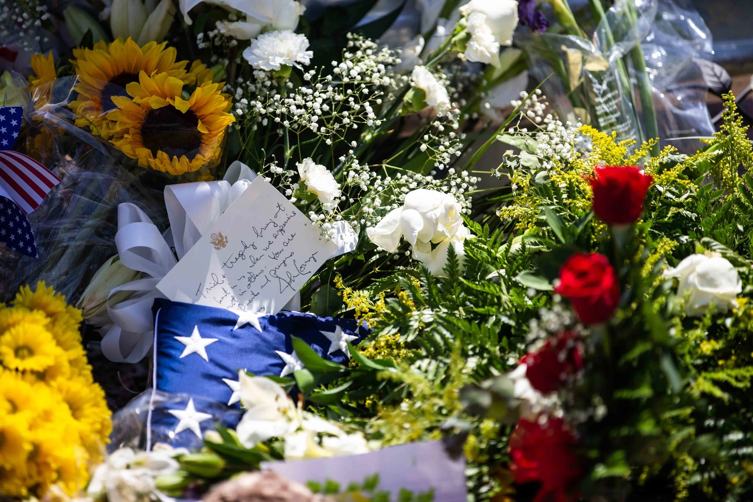 Locals bring flowers, stuffed animals, candels and posters to honor the memory of the victims of the mass shooting occurred in Walmart on Saturday morning in El Paso on Sunday, August 4, 2019.
