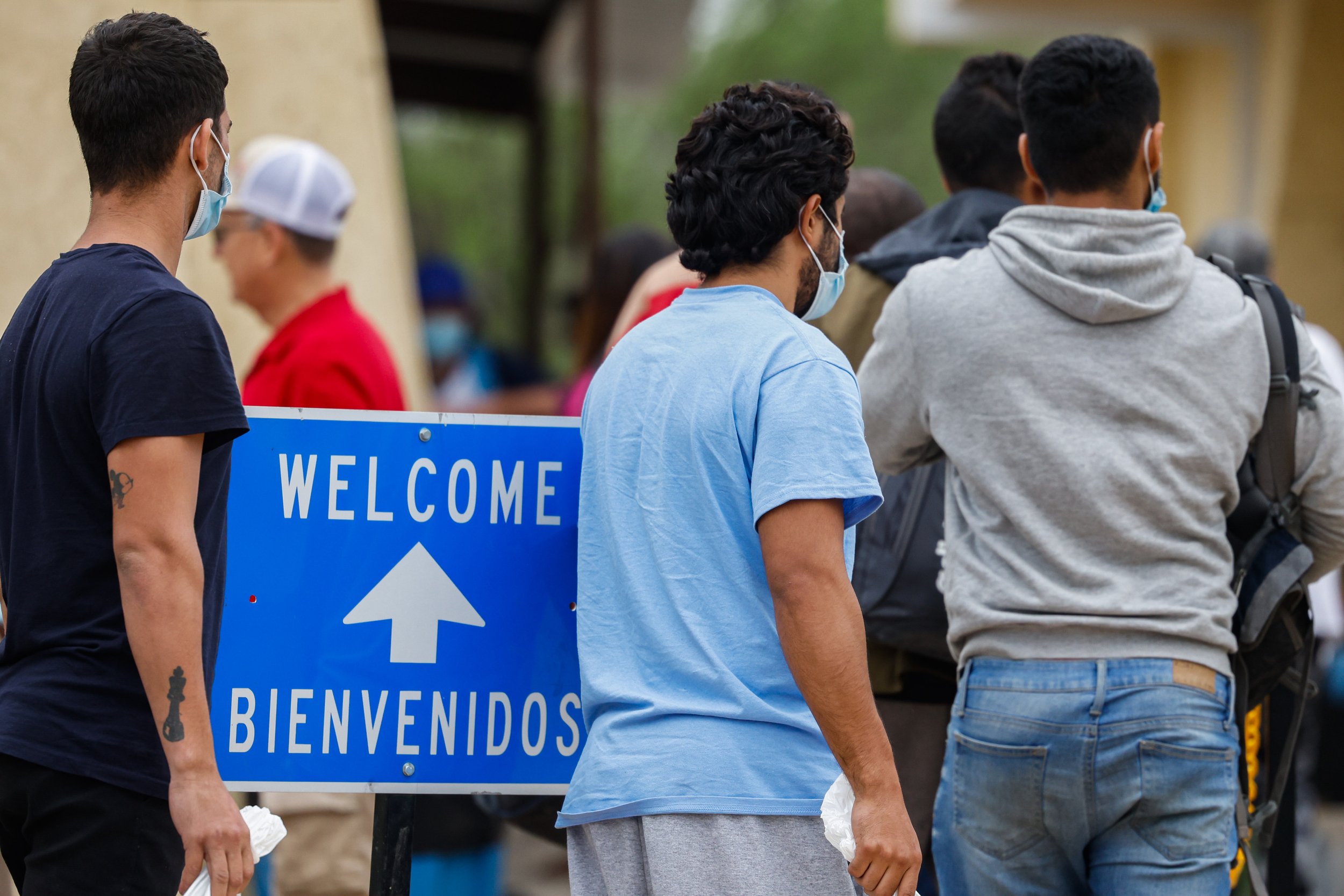  Venezuelan Victor Rodriguez, 26, middle, enters to the the Val Verde Border Humanitarian Coalition base of operations in Del Rio, Texas on Wednesday, April 20, 2022, after disembarking a bus that brought him along with other migrants from a detentio