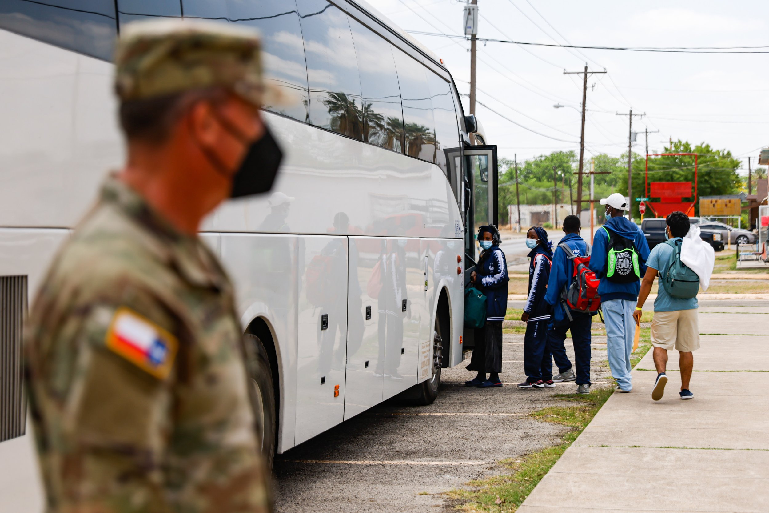  Victor Rodriguez, 26, walks to get on the bus that will take him along with other migrants to the East coast in Del Rio, Texas on Wednesday, April 20, 2022. Rodriguez, originally from Venezuela, requested to be part of those who are using the servic