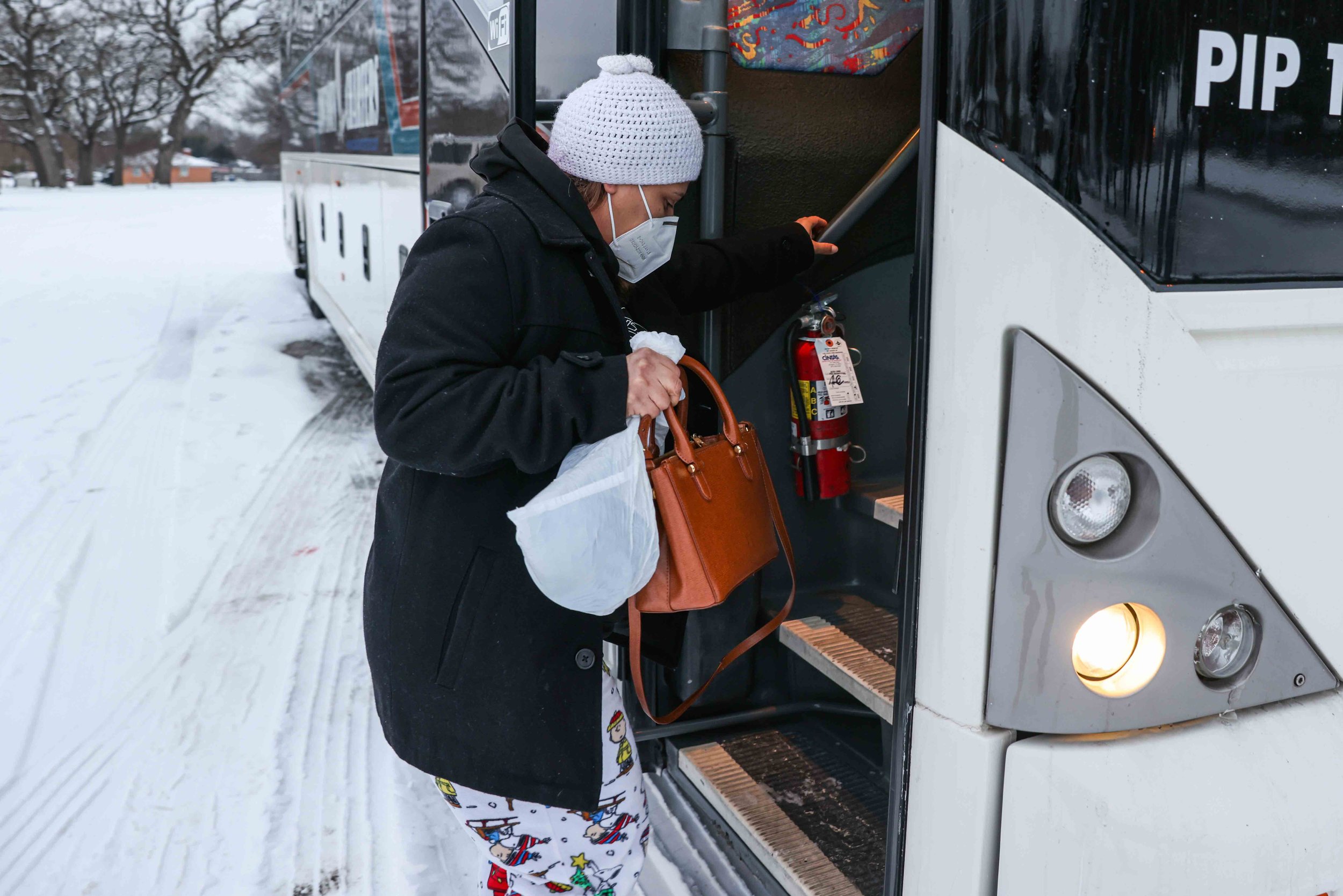  Marleny Almendarez, 38, arrives for the second consecutive night to the bus that serves as warming center located in Pleasant Oaks Recreation Center in Dallas on Wednesday, February 18, 2021. Almendarez house has inconsistent electricity to keep her