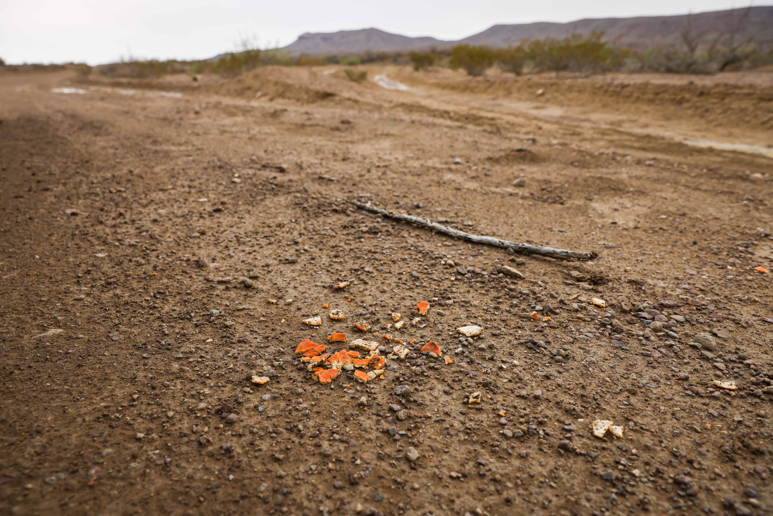  Orange peels lie on the ground in Jeff Davis County. Culberson County Sheriff Oscar Carrillo said he received a distress call from a rancher using a satellite phone on June 21. The rancher had found two migrants in the desert: Raul, 35, and his son 