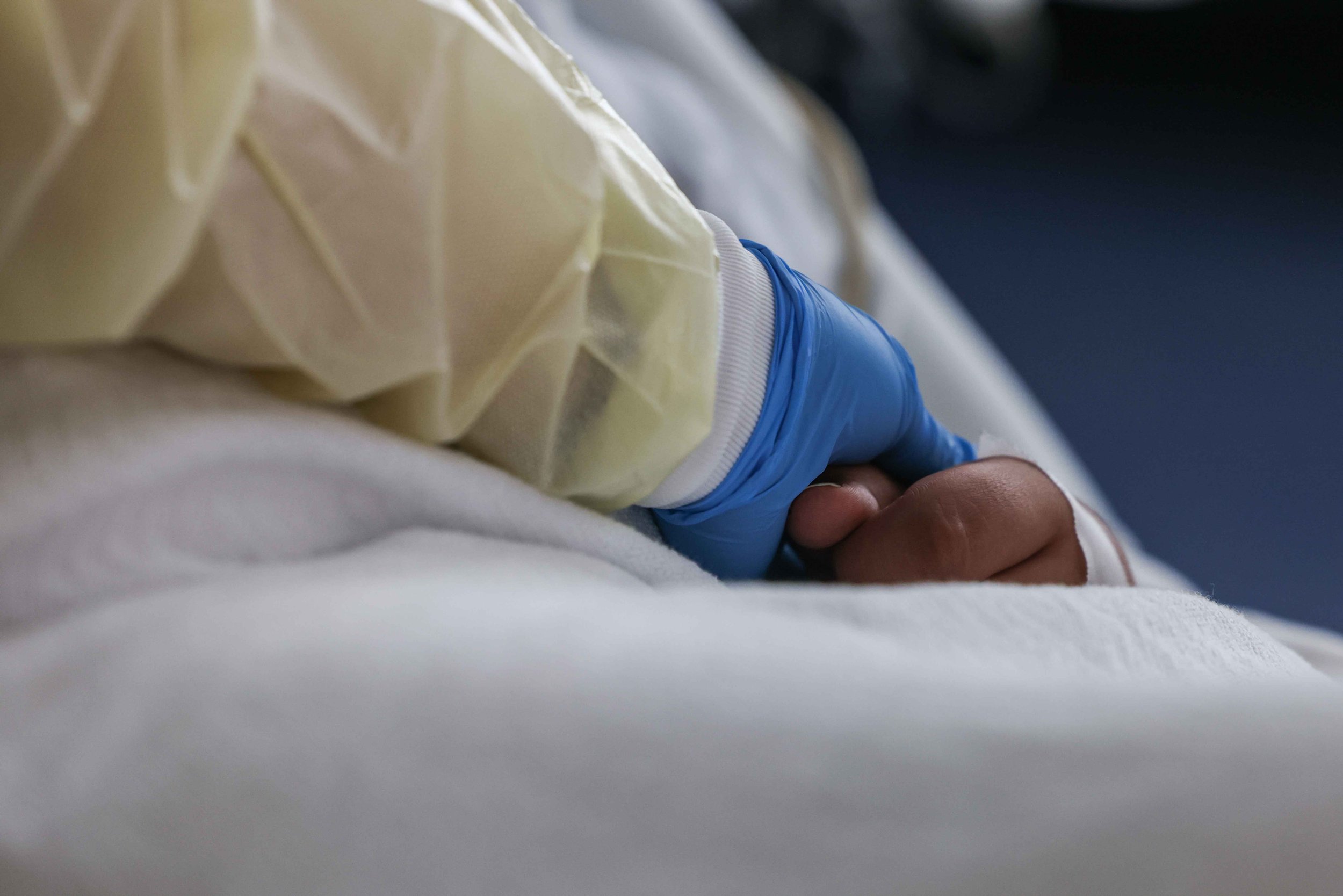  Nurse Christina Walker checks on Francisco Rosales, 9, who is being treated as a COVID-19 patient in the pediatric intensive care unit at the Children's Medical Center in Dallas on Friday, August 13, 2021. Rosales has been hospitalized since last Su