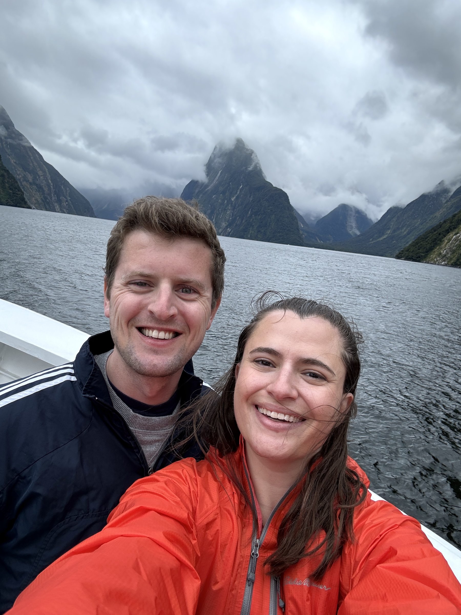 a couple in a boat during a Milford Sound day tour - 12 Days in New Zealand