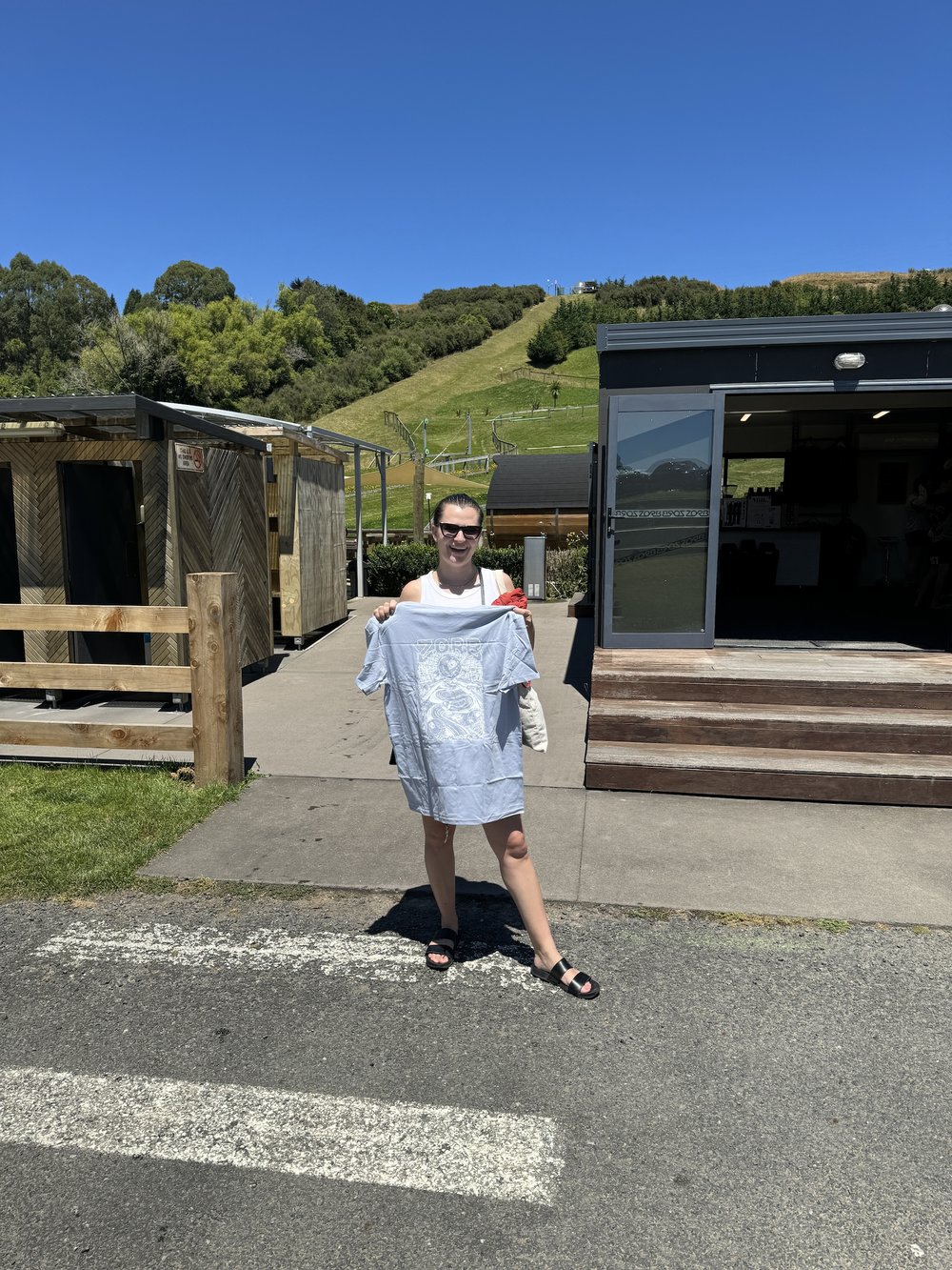 woman holding a shirt - 12 Days in New Zealand