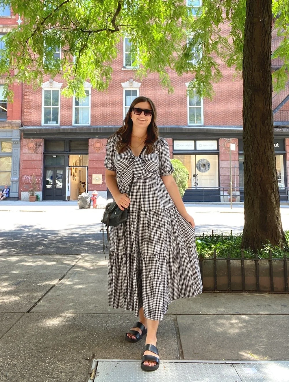 Keep Calm and Chiffon Blogger Austen Tosone shares The Summer Outfits I’m Wearing on Repeat This Year - in photo: Austen wearing Gingham Dress and Sandals