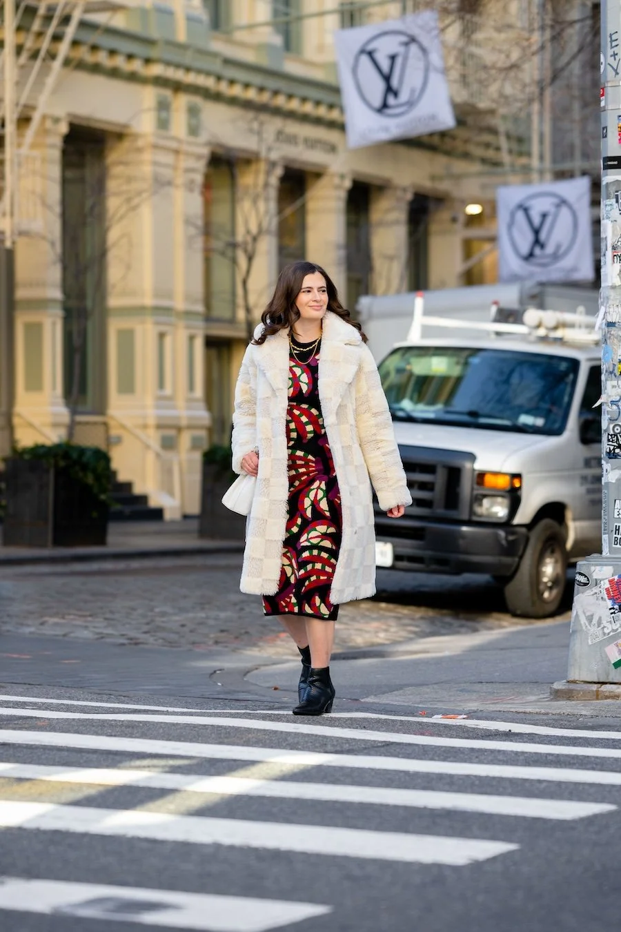 Tips For Balancing Organic and Sponsored Content Austen Tosone begins to cross a city street.