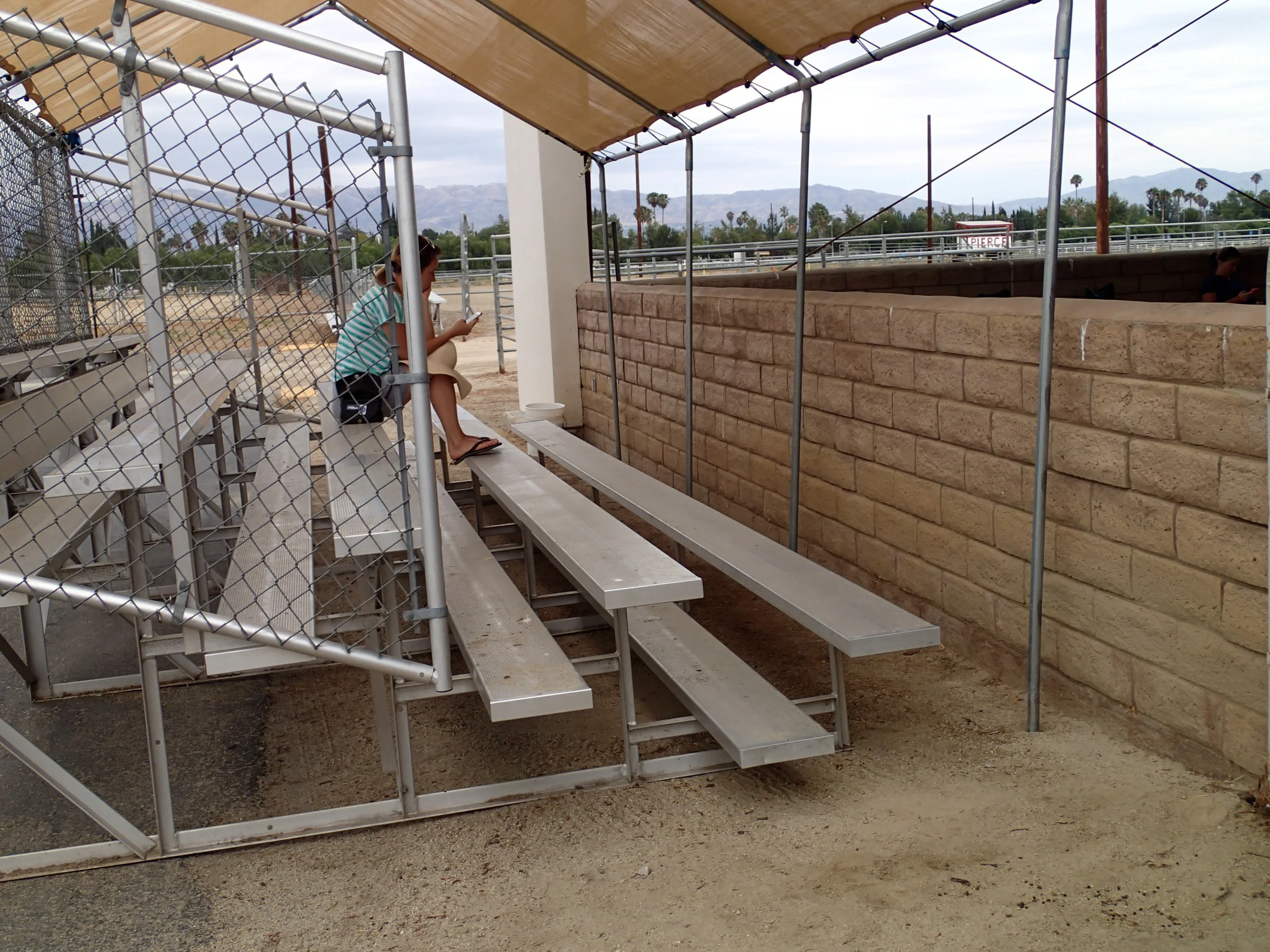 Bleachers w/shade set up outside covered arena
