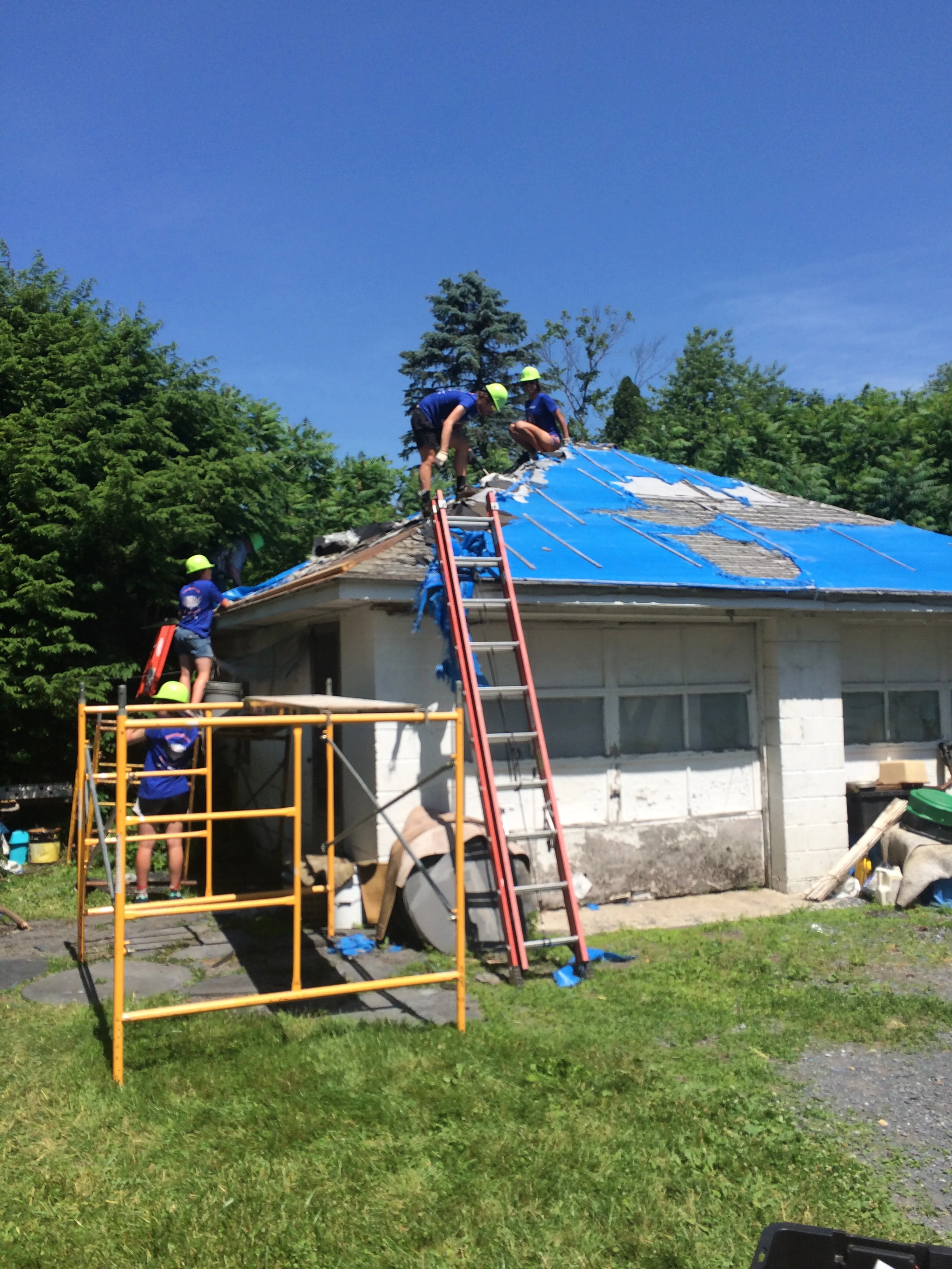 Build day- we removed the old roofing and put up a new one! That's me on the top!