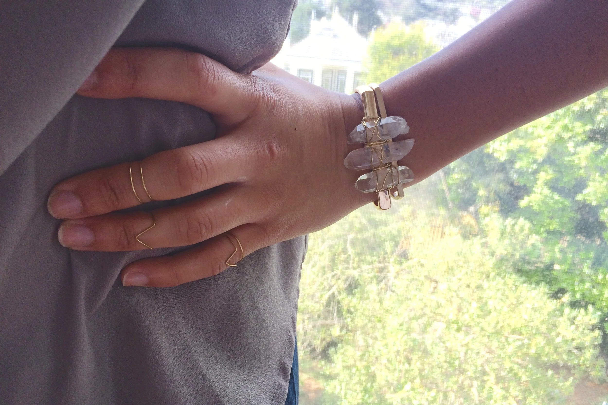 Paired with another thin gold cuff