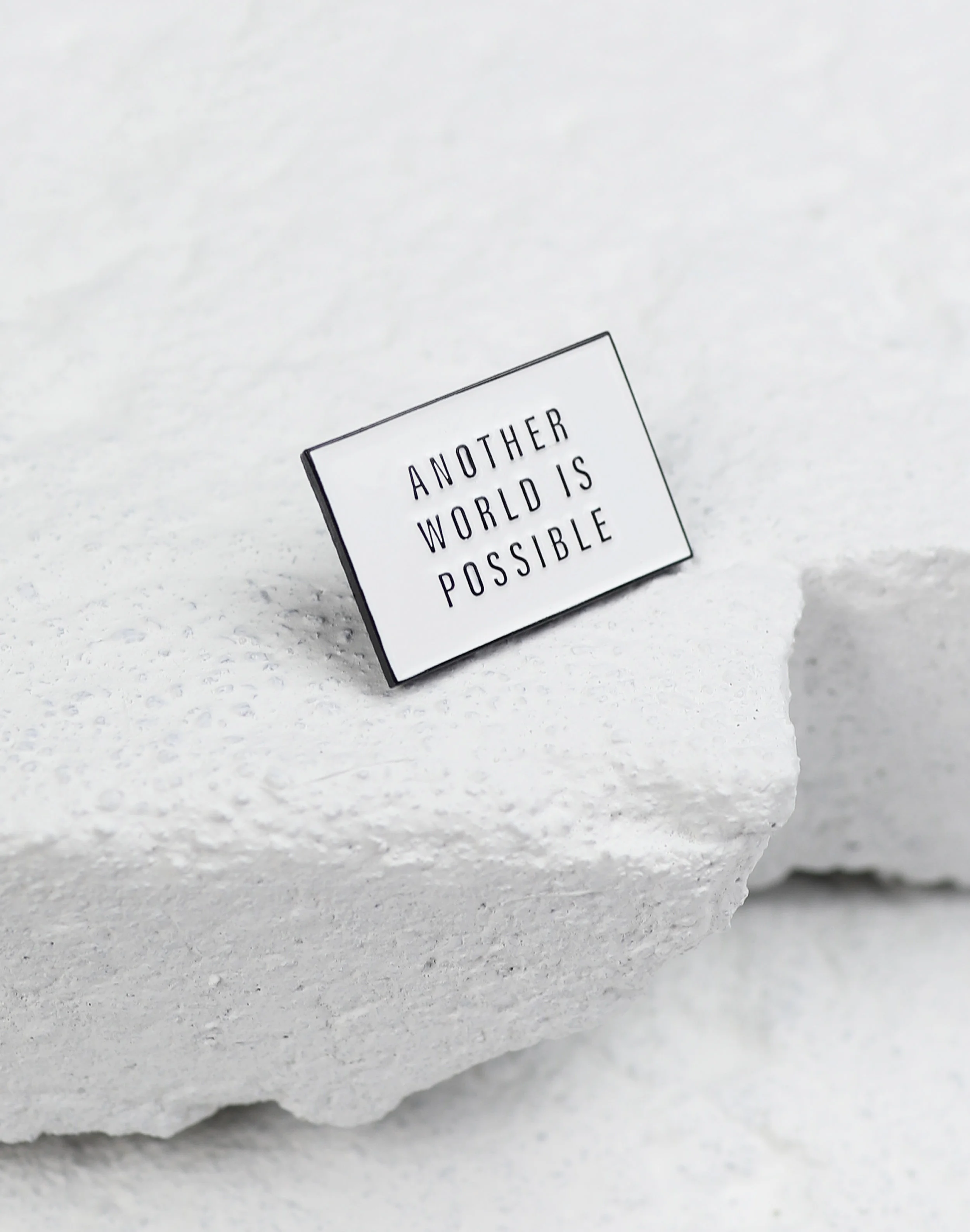 another world pin white.jpg