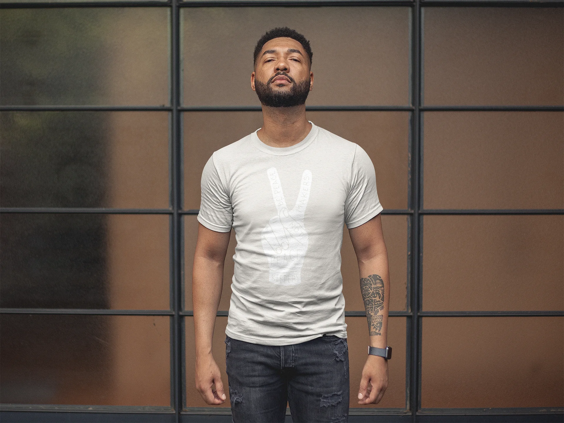 black man with beard wearing natural peacemaker shirt.jpg