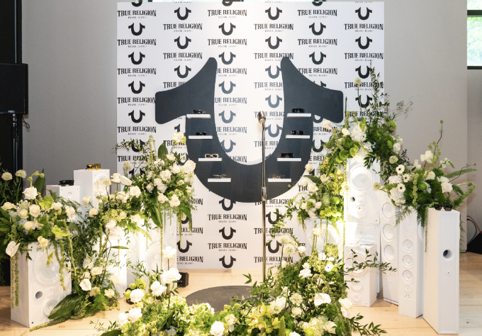  For FGX international, we developed an immersive event with dedicated brand stations that brought each brand’s personality to life through interactive elements, including custom embroidery at Wrangler, a photo-worthy stage moment at True Religion, p