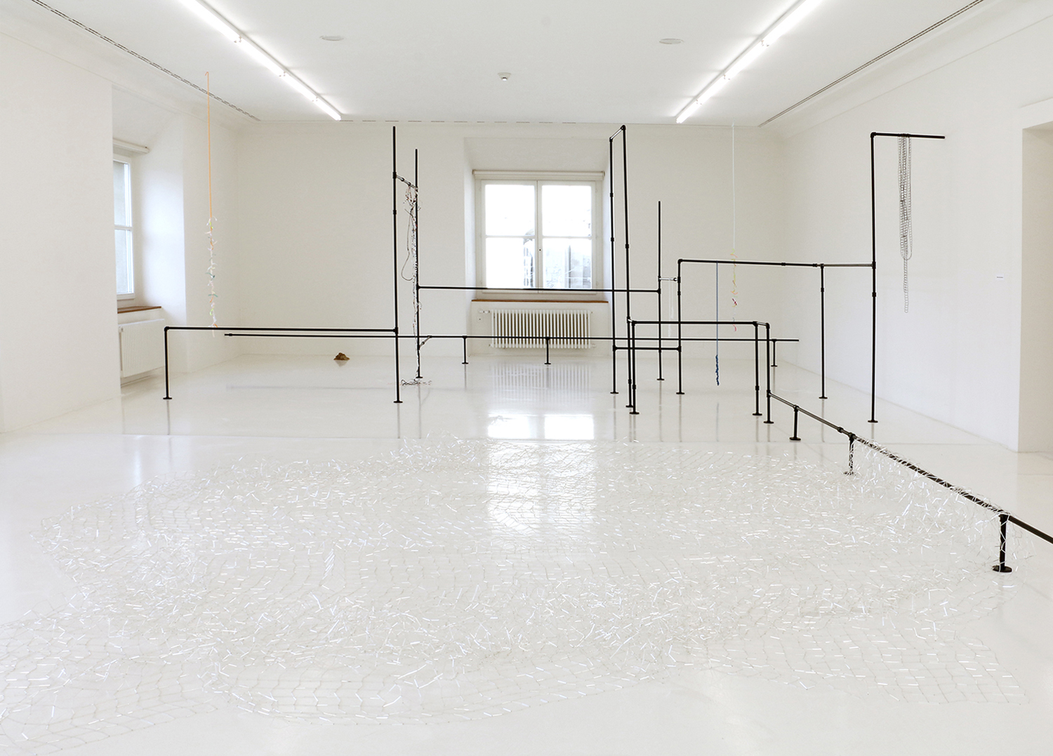   The waves broke and spread their waters swiftly over the shore , 2019, Installation in  Träume werden wahr  at Helmhaus, Zürich  Installation with  Chain , 2019, glass;  Storms , 2018, rope;  Black cloud , 2019, rope;  Witch ladder / kirke , 2019, 