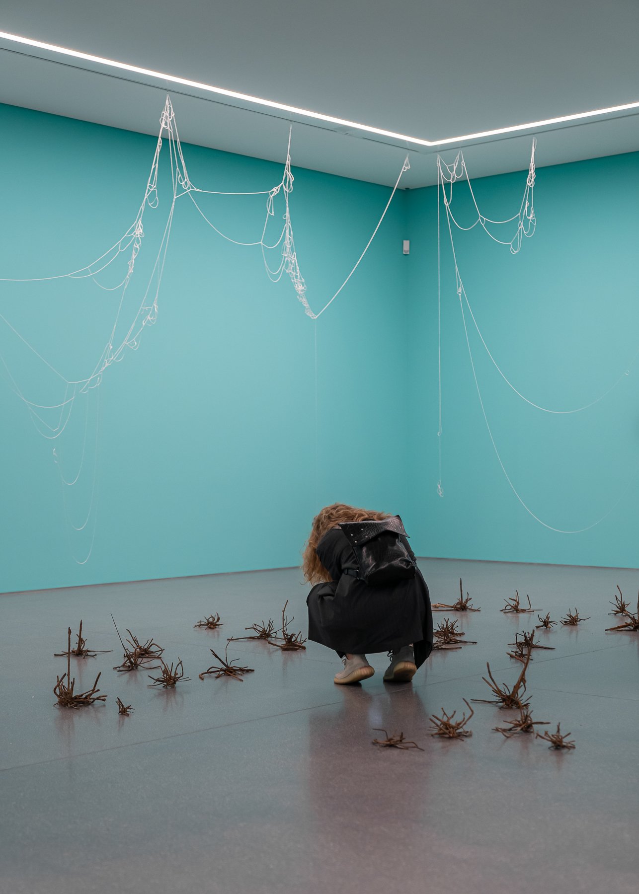  Making Waves   Installation with ‘Atoms of Delight’ (glass beads and nylon thread), ‘Small Fires’(nails and magnets) and wall paint  at Bündner Kunstmuseum, Chur  Fotocredit: Yanik Bürkli, on the picture: Anna Konstantinova 