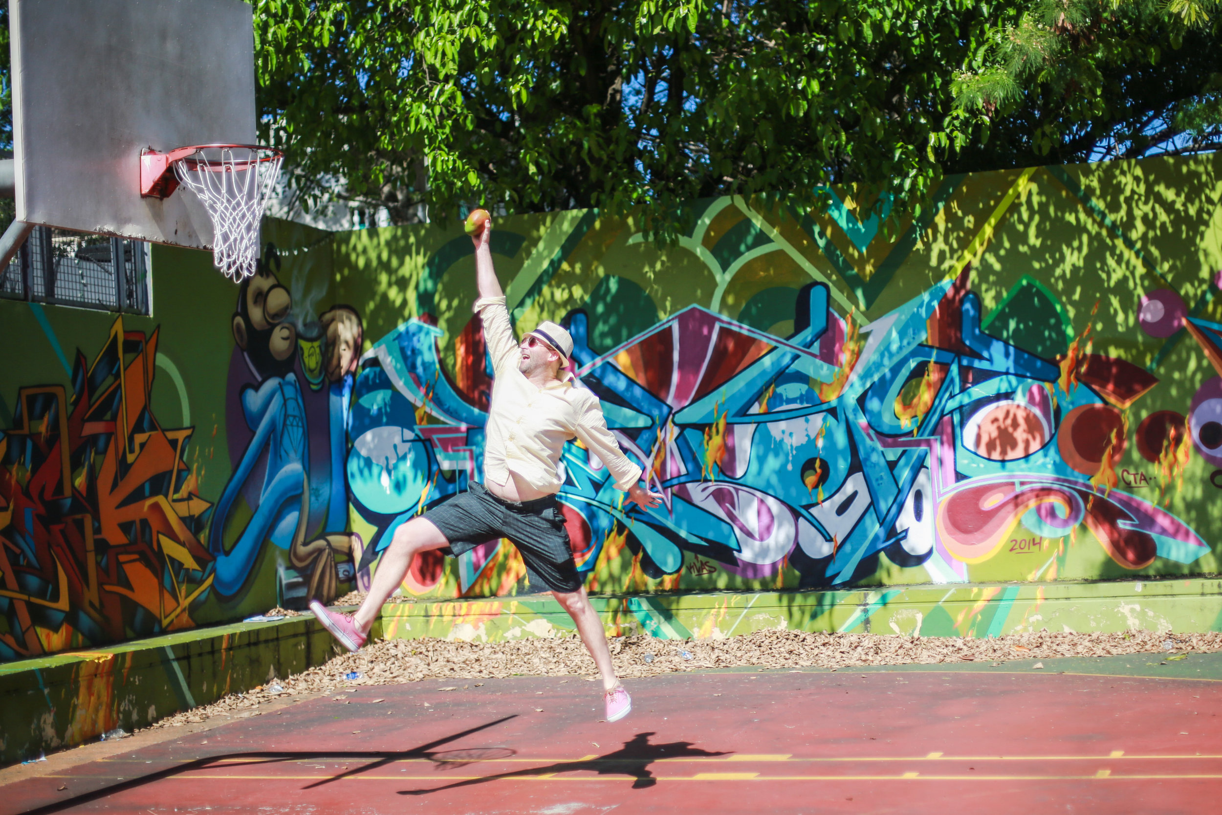Never a dull moment with this one.... While walking past a local bball court, this old college hoops player couldn't resist attempting to dunk a mango. Key word being attempt. (He was more of a 3point wonder.)