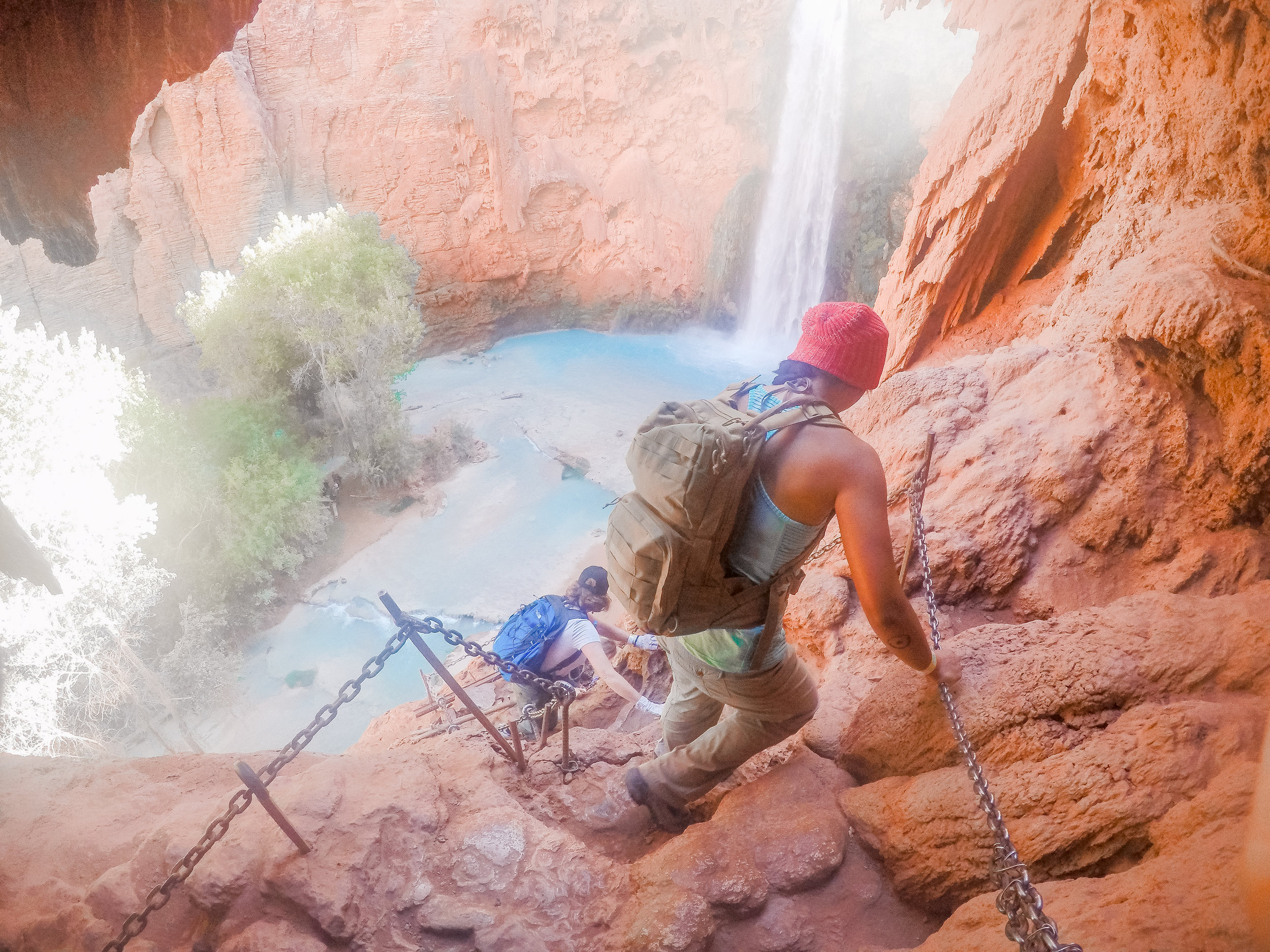 Maneuvering the ladder system. It's a straight drop down, and very slick. We had to watch our footing and hang onto the chains for dear life. Intense but so worth it! 