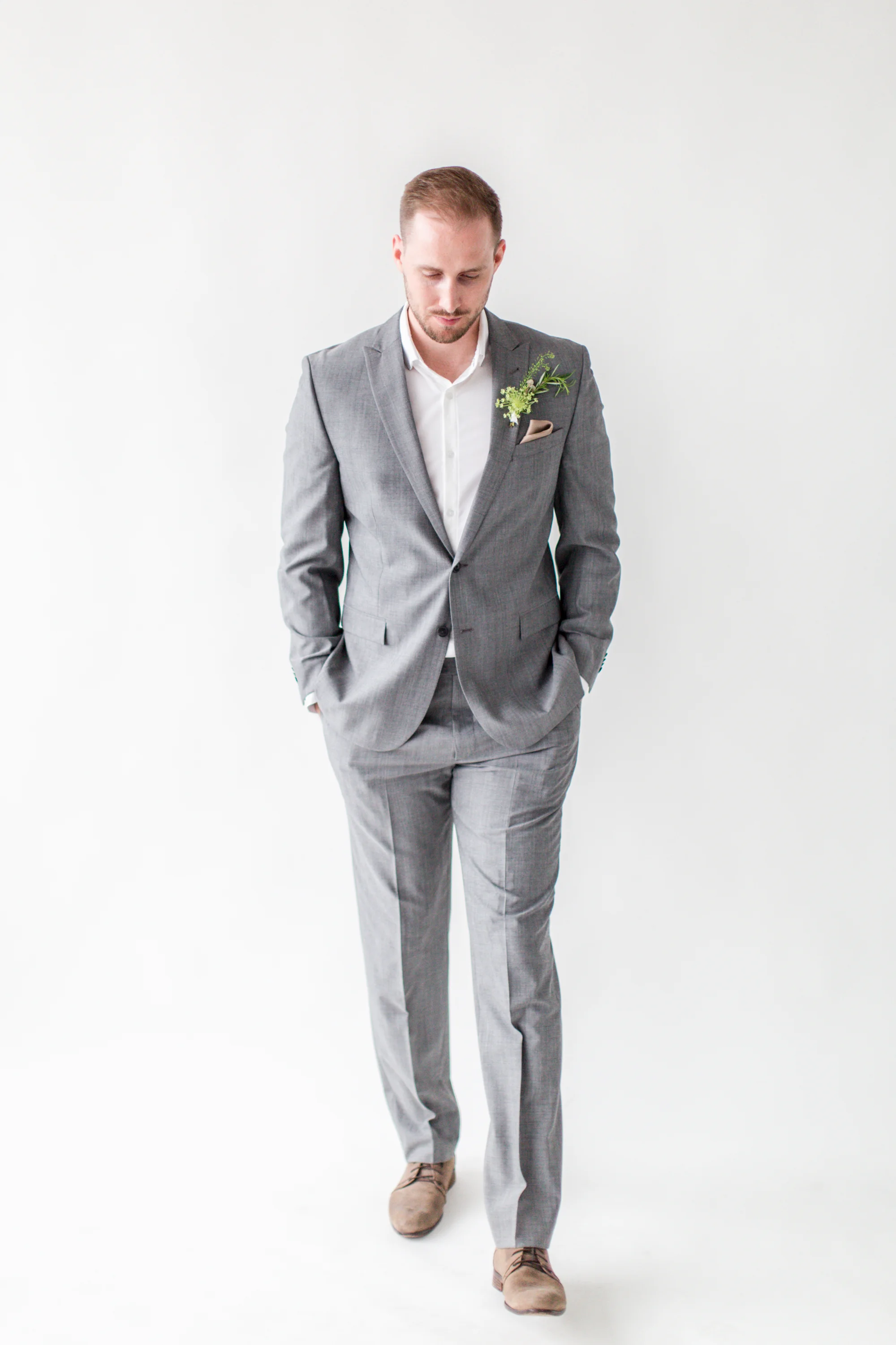 Real groom Daniel wearing a moisture-wicking dress shirt by Mizzen + Main; suit by Joseph Abboud