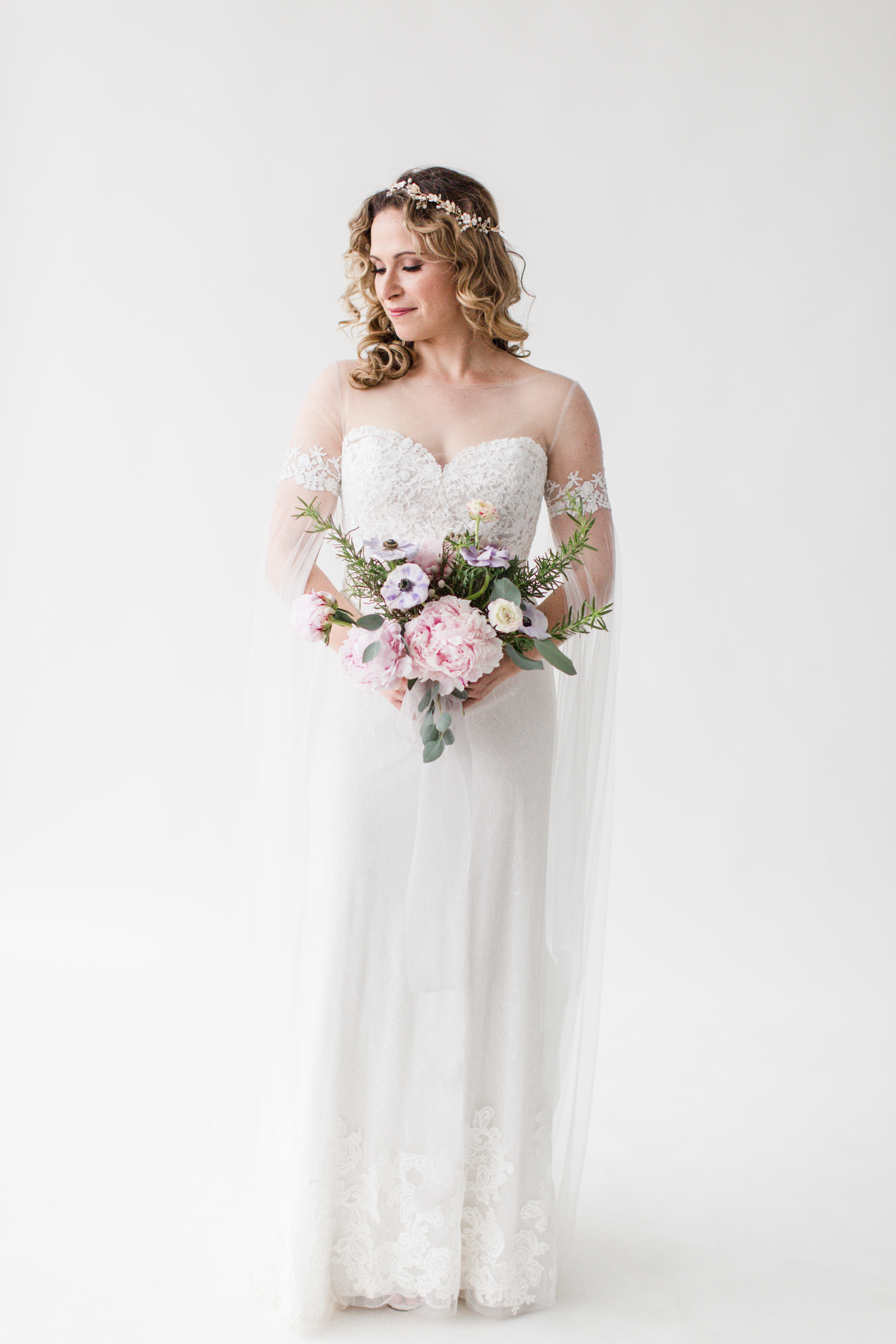 Real bride Dominika wearing the Willowby "Liberty" by Watters gown, paired with a Wtoo "Ellie Cape"