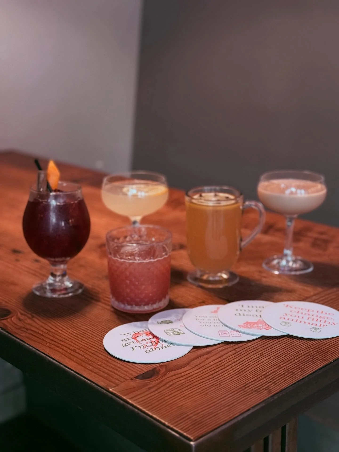 NEW HOLIDAY COCKTAILS!!! 🎄🎉🧑&zwj;🎄 This year&rsquo;s Home Alone theme is full of spirit and accompanied by quote-able coasters made by the talented @rebeccahartzler. Come on in from now until New Years and try them all. See you all soon, ya filth